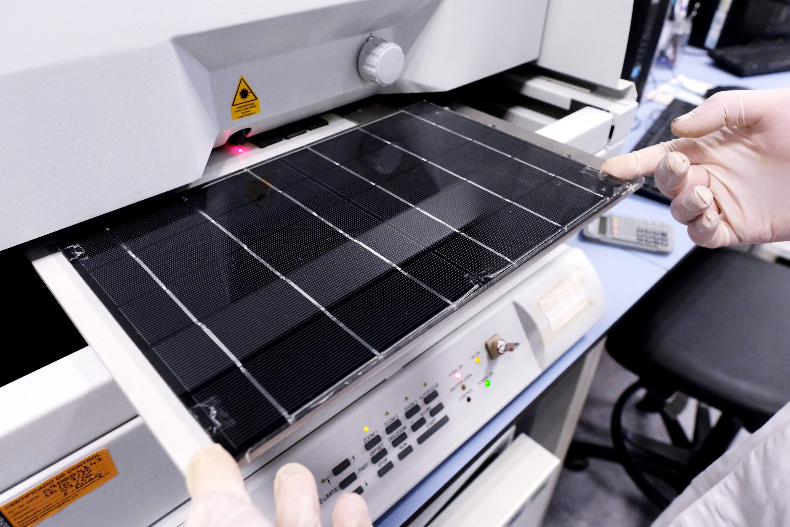 Laboratory machinery for process monitoring and photovoltaic systems analysis, representing automated sensing platforms, real-time data acquisition and advanced analytics for materials and device research.