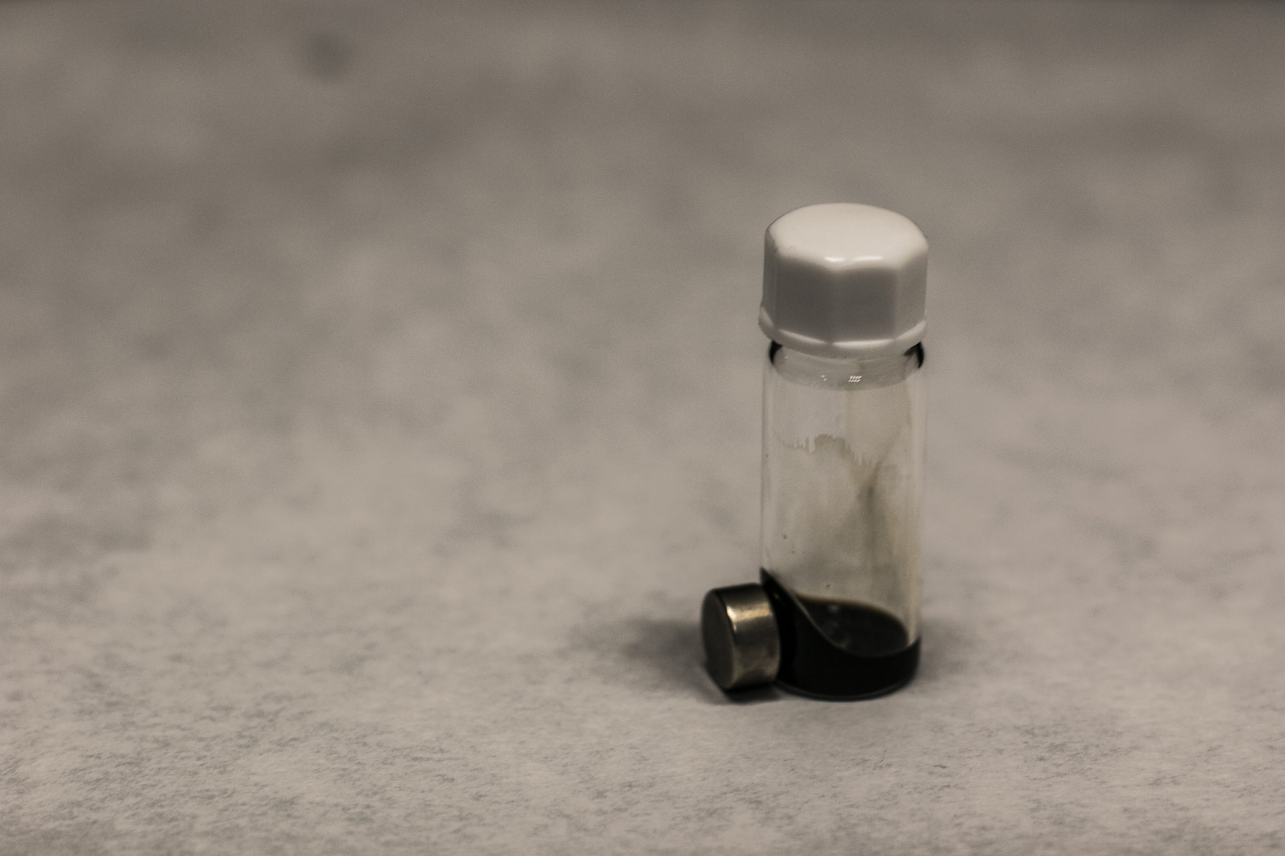 Liquid material inside a laboratory container, representing experimental nanomaterial synthesis and solution-based processing in advanced materials research