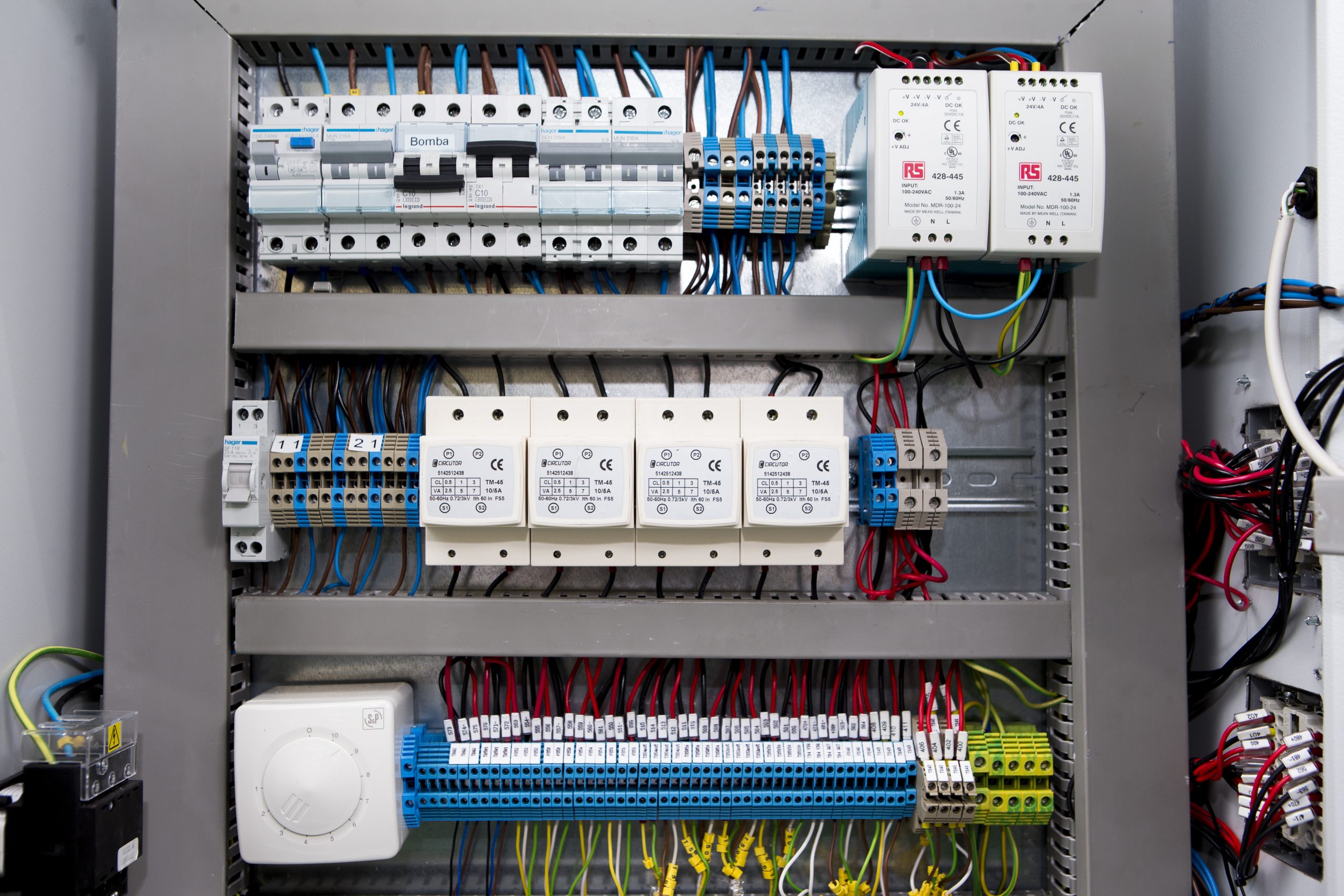 Internal view of HVAC laboratory machine with complex wiring and components for advanced control testing, energy system optimisation and smart grid integration research.